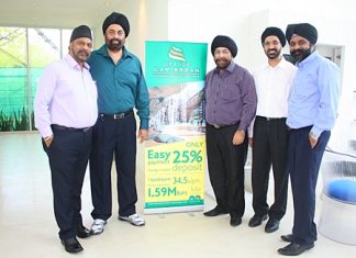 Directors of Blue Sky Developer Co. Ltd., from left, Tripatpal Singh Sachdev, Manmohan Singh Chawla, Popinder Singh Khanijou, Chawarin Sakulsacha, and Narinder Singh Gulati pose for a photo at the official opening of the project, June 16.